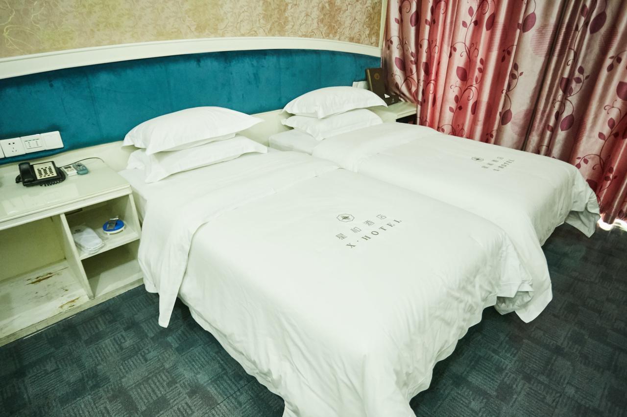 Xinghe Xinfeng Hotel Canton Esterno foto